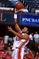 Ms. Ford playing college basketball.