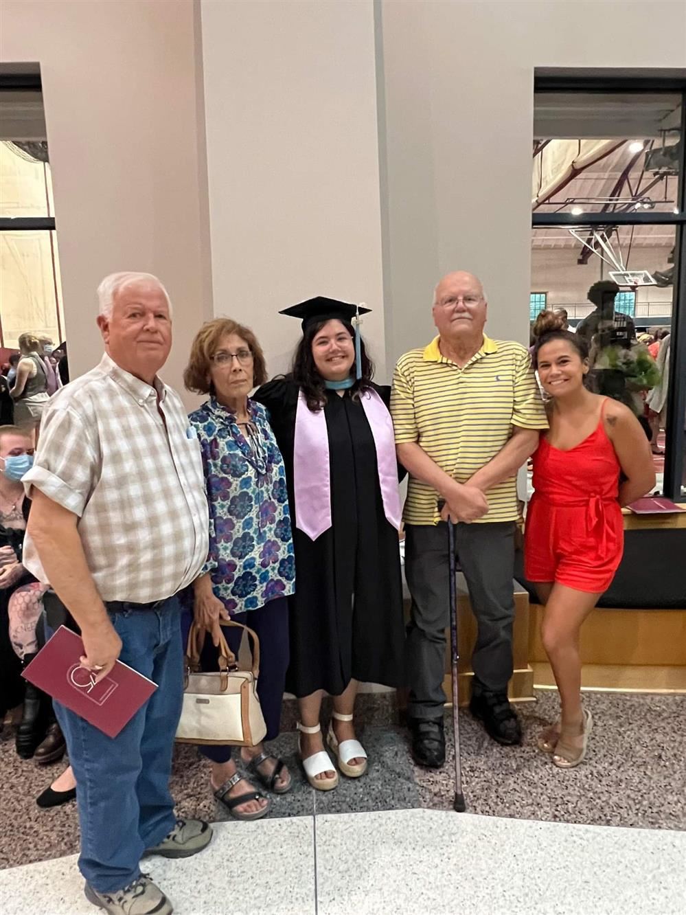 At my Grad School Graduation with my Grandparents and sister.