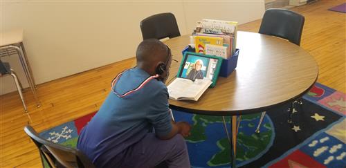 student with reading buddy